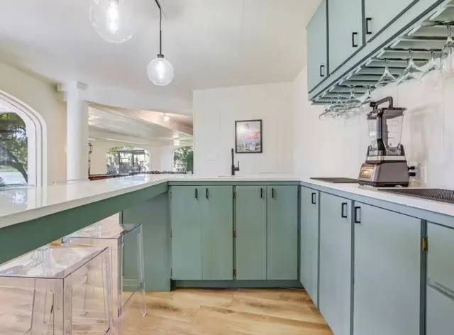 a view of a kitchen from the hallway