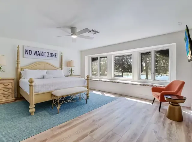 a bedroom with furniture and windows