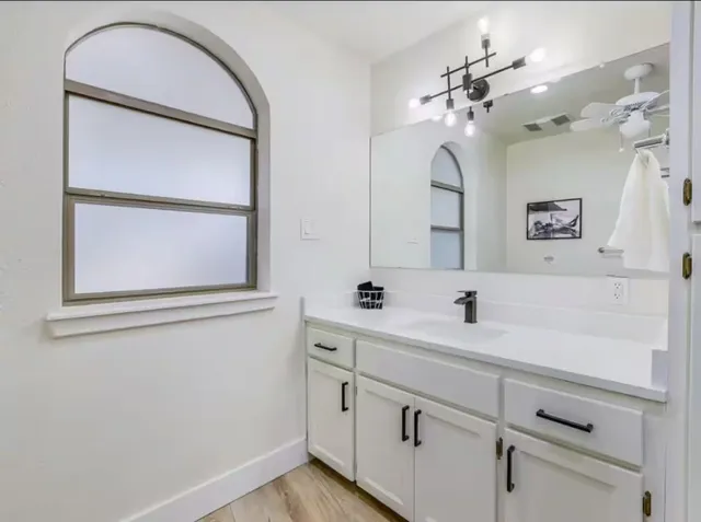 a bathroom with a sink and a mirror