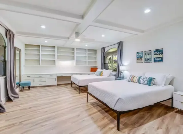 a bedroom with a bed and window