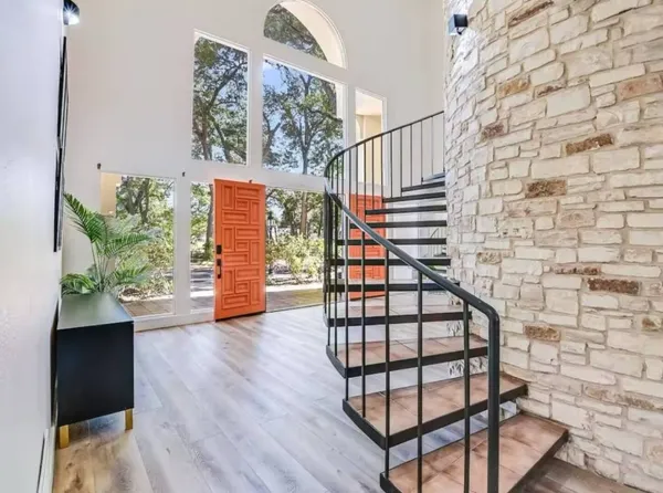 a view of entryway with wooden floor