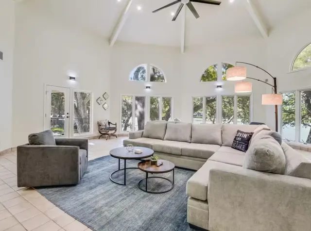 a living room with furniture and a large window