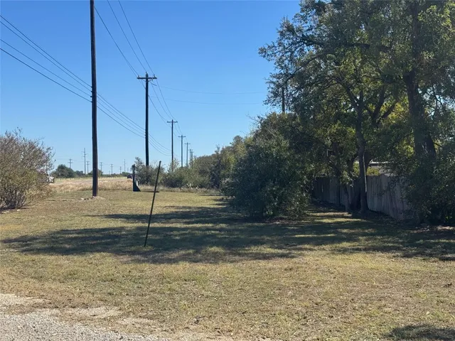 a view of a road with a yard