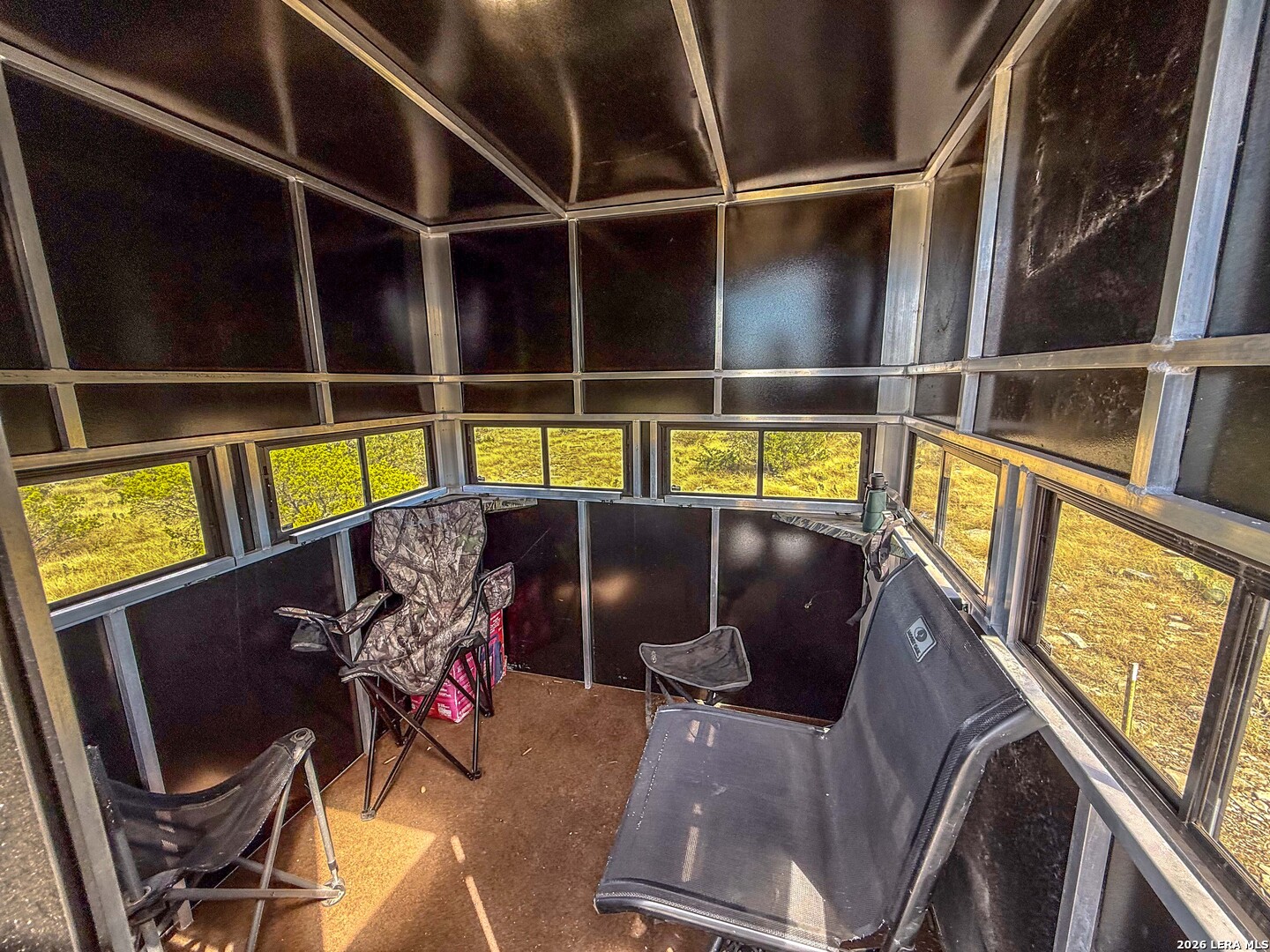 0 West Cooper Road Comstock, TX 78837 - Photo 23 of 49 a view of a chairs and table in a balcony
