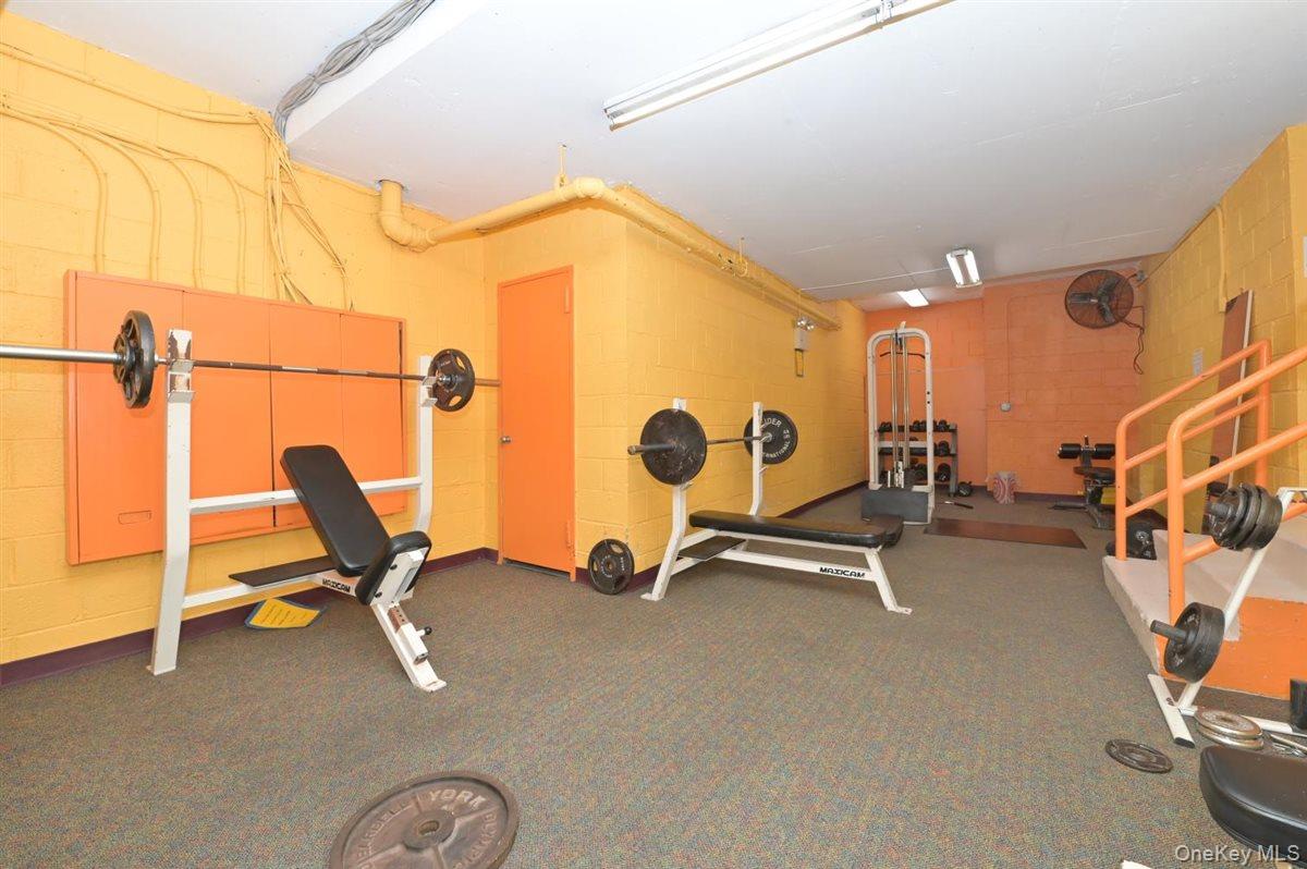 175-20 Wexford Terrace, Unit 16L Queens, NY 11432 - Photo 12 of 26 a view of a room with gym equipment