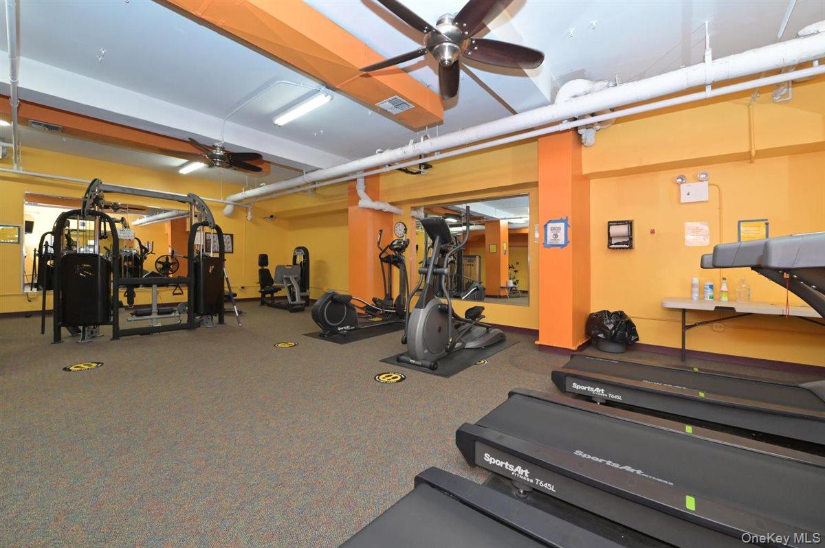 175-20 Wexford Terrace, Unit 16L Queens, NY 11432 - Photo 13 of 26 a room with gym equipment