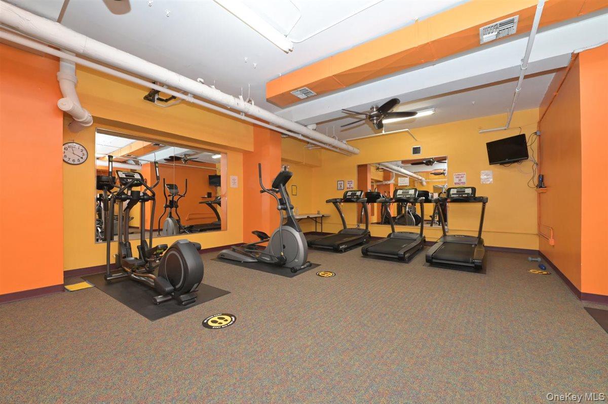 175-20 Wexford Terrace, Unit 16L Queens, NY 11432 - Photo 14 of 26 a view of a room with gym equipment