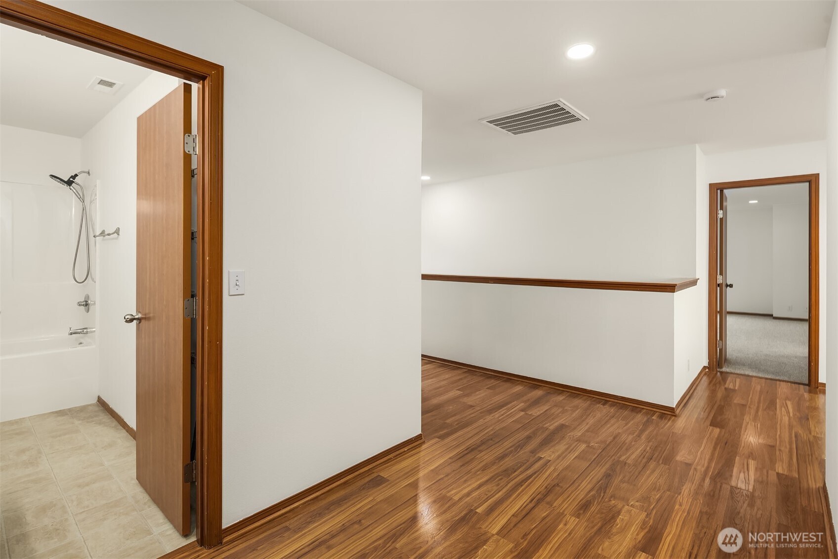 21353 Southeast 289th Way Kent, WA 98042 - Photo 24 of 40 a view of a hallway with wooden floor