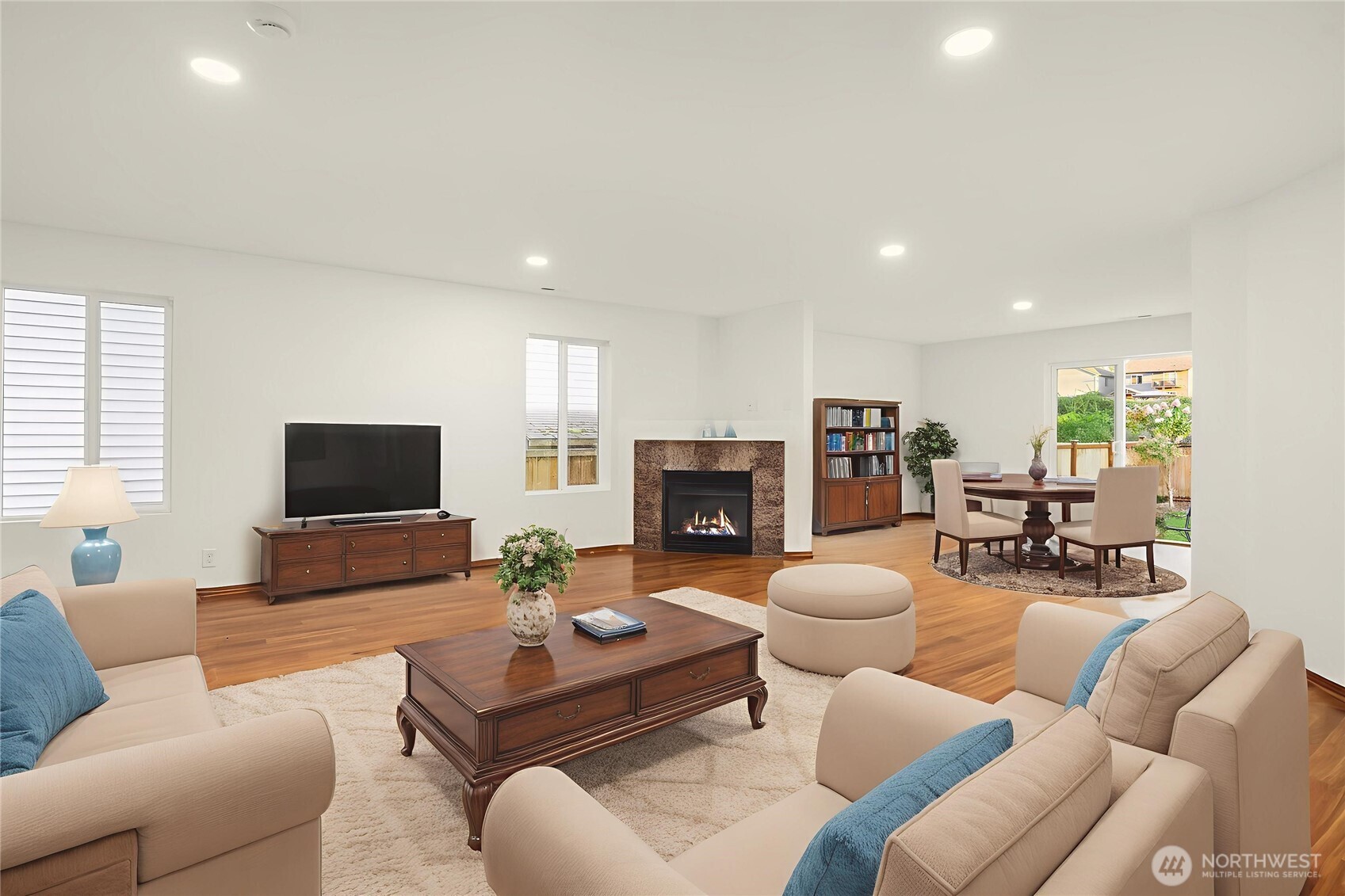 21353 Southeast 289th Way Kent, WA 98042 - Photo 3 of 40 a living room with furniture flat screen tv and a fireplace