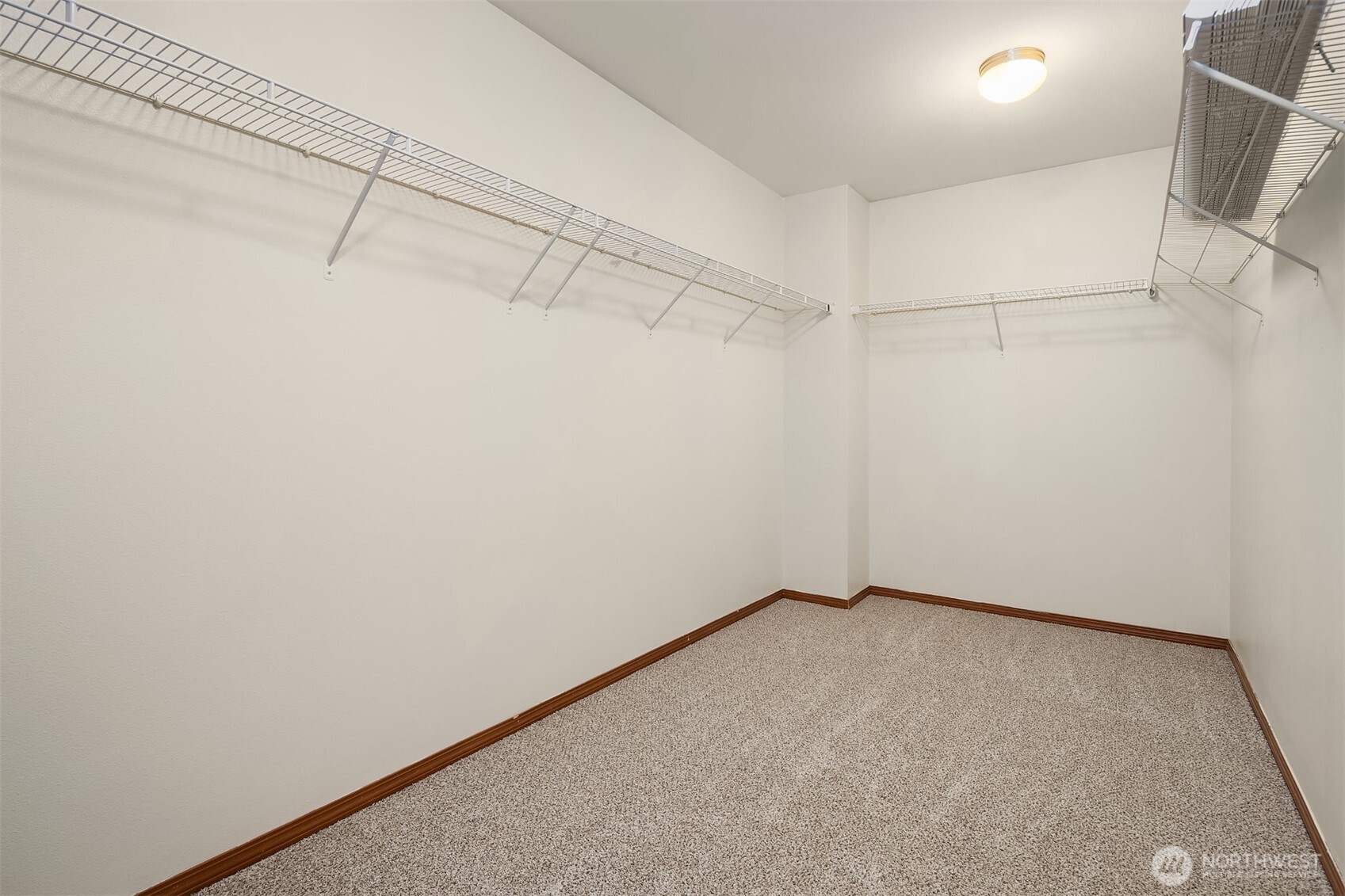 21353 Southeast 289th Way Kent, WA 98042 - Photo 34 of 40 a view of a room with racks on the wall