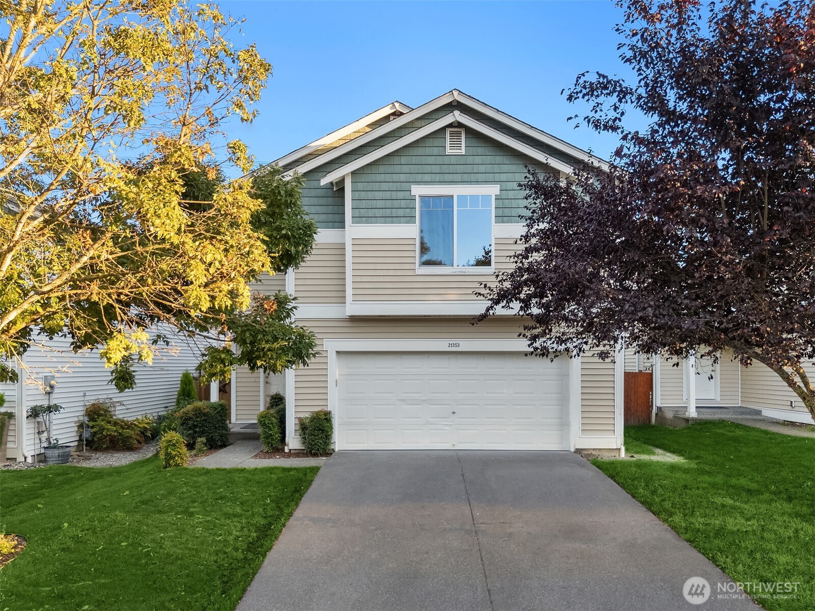 21353 Southeast 289th Way Kent, WA 98042 - Photo 36 of 40 a front view of a house with a yard and garage