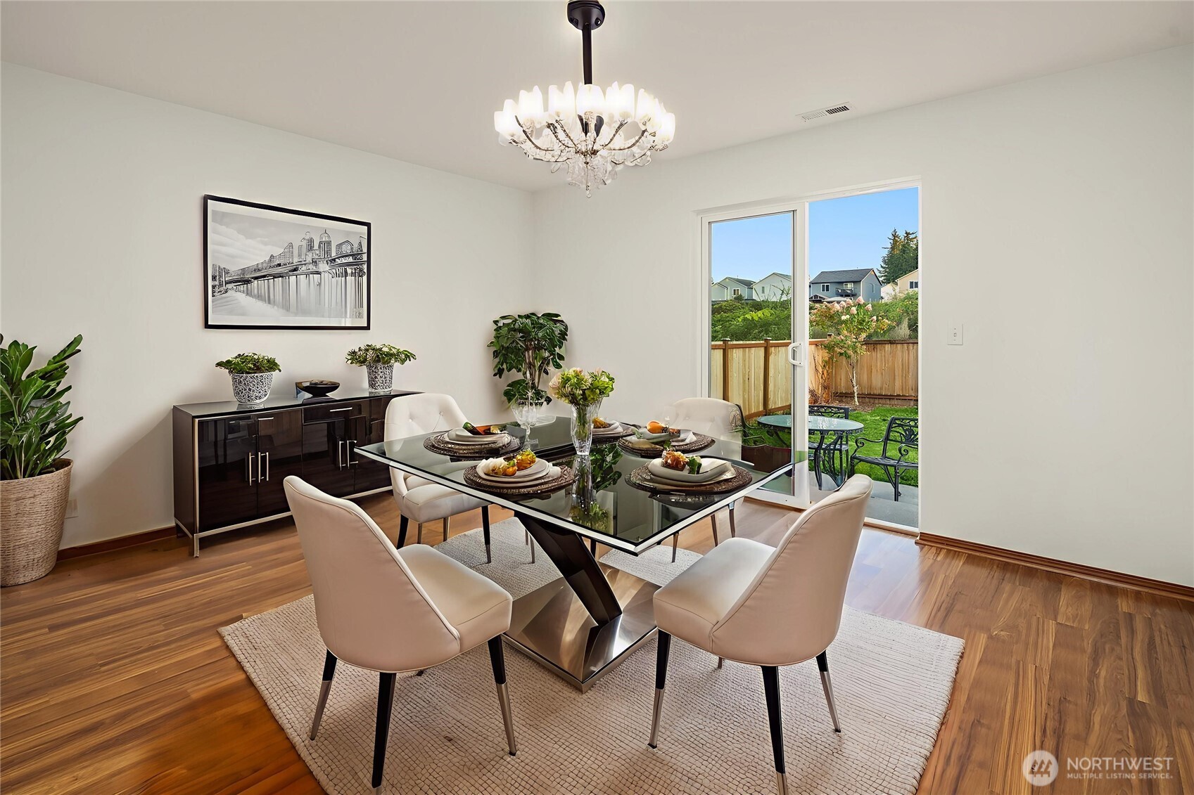 21353 Southeast 289th Way Kent, WA 98042 - Photo 5 of 40 a view of a dining room with furniture window and wooden floor