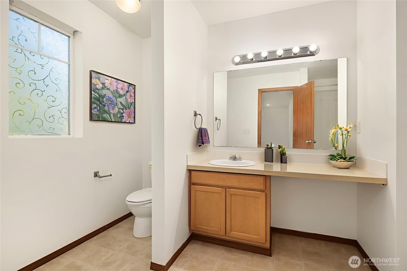 21353 Southeast 289th Way Kent, WA 98042 - Photo 8 of 40 a bathroom with a toilet sink and mirror