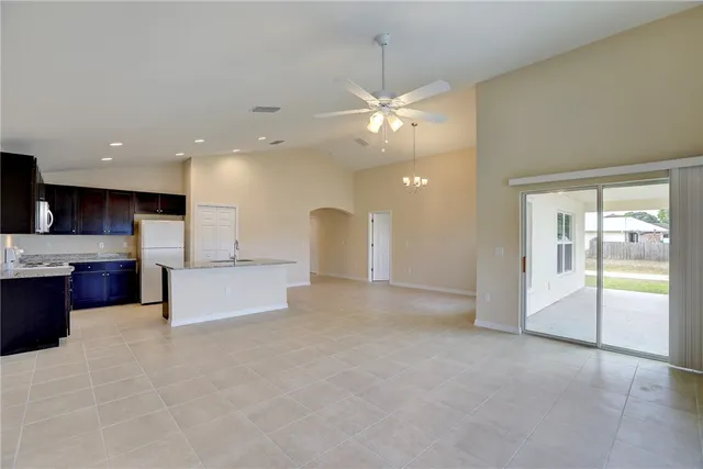 a view of a kitchen with a sink and a large window