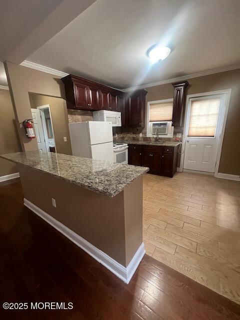 20-28 East Main Street, Unit 6 Freehold, NJ 07728 - Photo 3 of 11 a large kitchen with granite countertop a stove and a refrigerator
