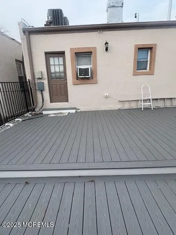 a view of wooden floor and windows in a room