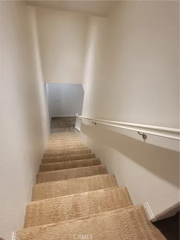 an empty room with a empty space and windows