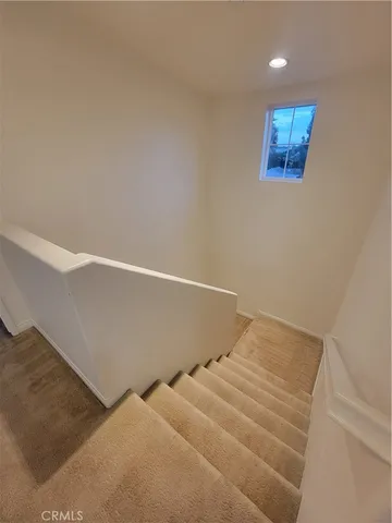 an empty room with a empty space and windows