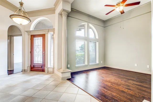 a view of a room with wooden floor and balcony