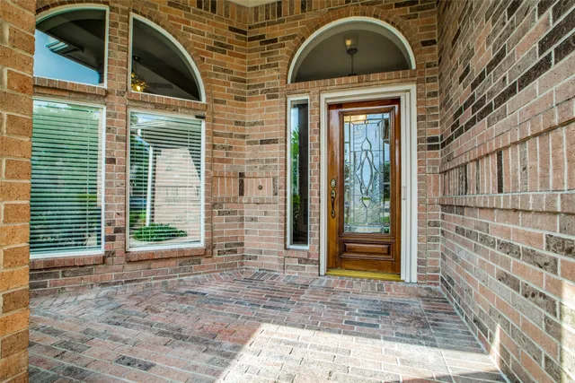 a front view of a house with a glass door