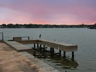 a view of a lake with a house in the background