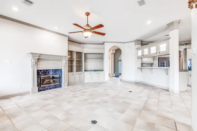 a view of an empty room with a fireplace