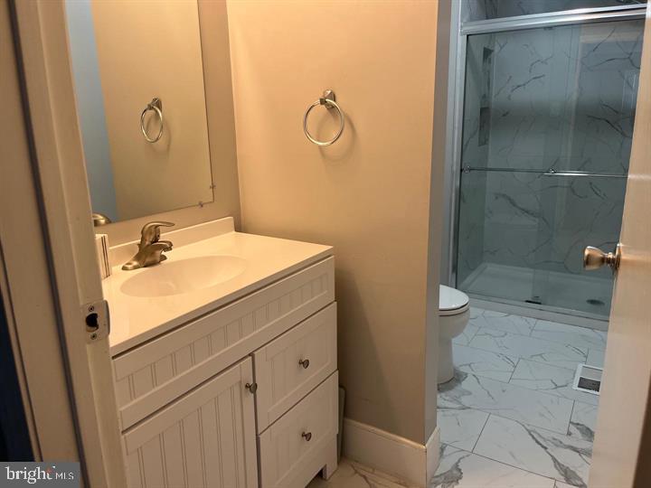11 Kent Place Sewell, NJ 08080 - Photo 12 of 19 a bathroom with a granite countertop sink a toilet and shower