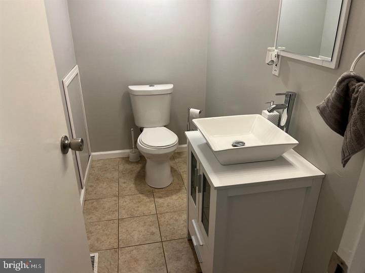 11 Kent Place Sewell, NJ 08080 - Photo 18 of 19 a white toilet sitting next to a bathroom sink