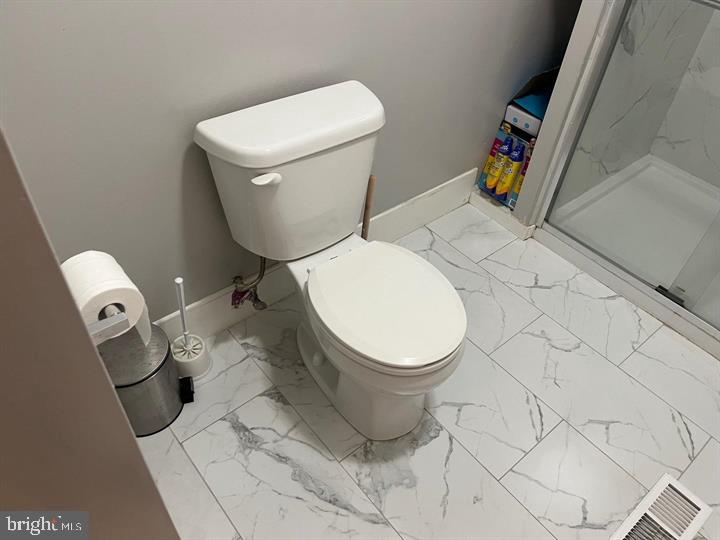 11 Kent Place Sewell, NJ 08080 - Photo 10 of 19 a white toilet sitting next to a white cabinet