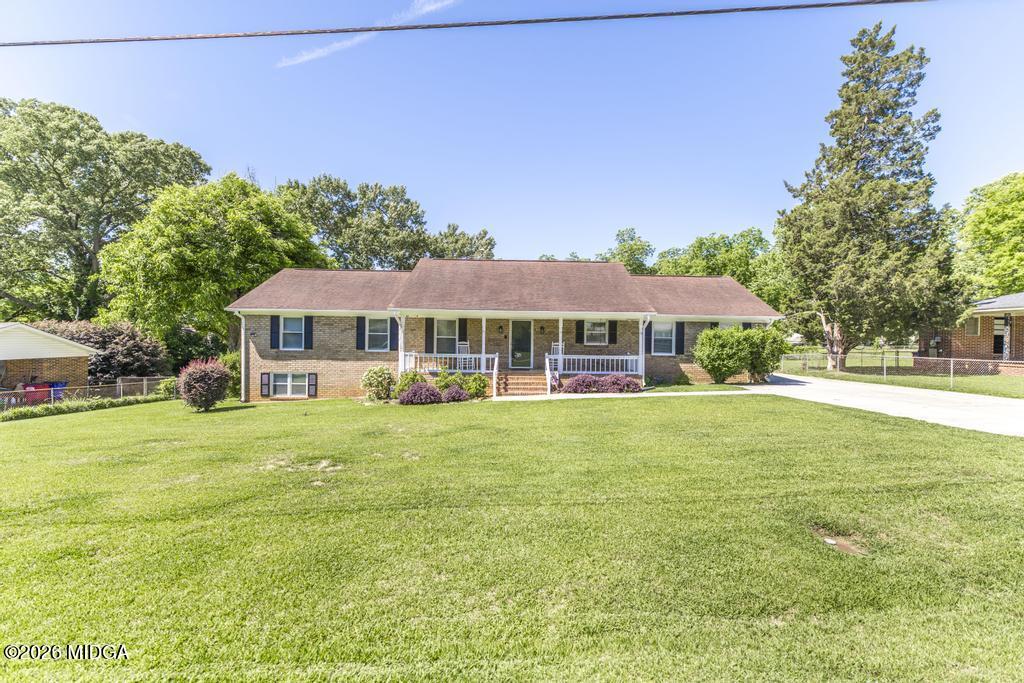 3710 Sandy Circle Macon, GA 31216 - Photo 3 of 44 a front view of a house with a yard