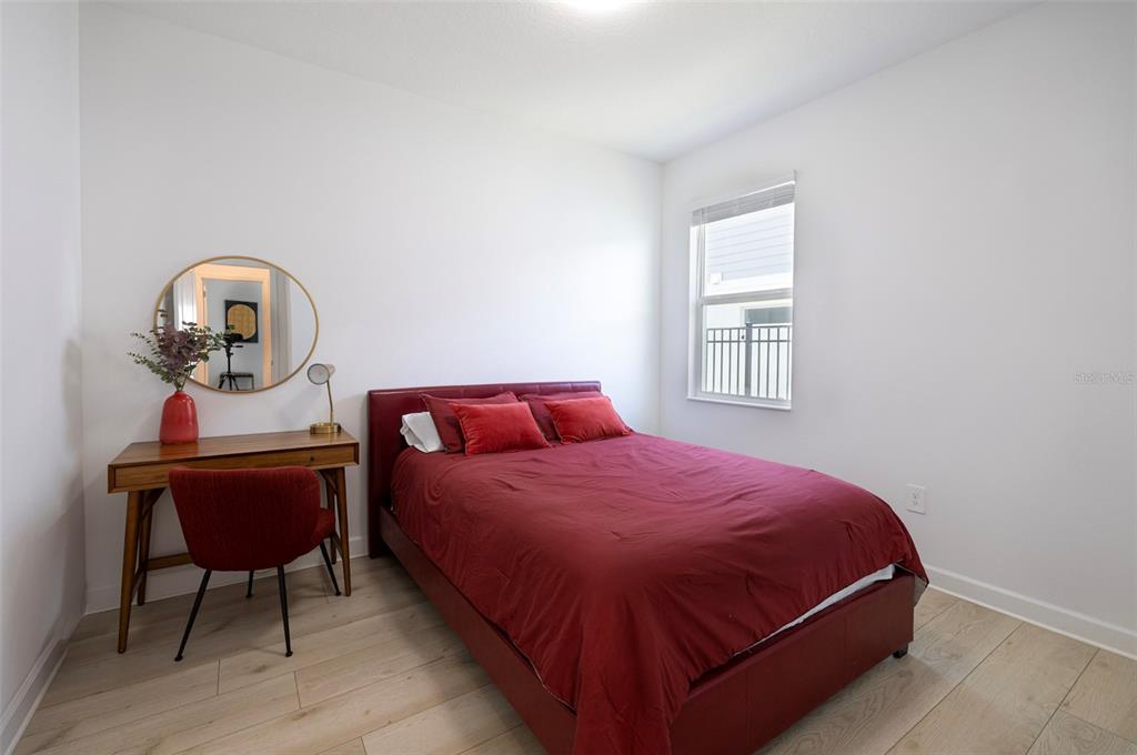 4507 Hillingdam Road Davenport, FL 33837 - Photo 12 of 83 a bedroom with a bed a table and dresser