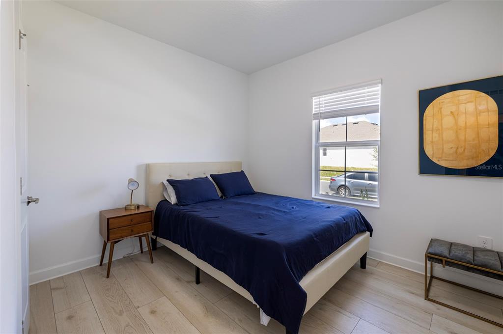 4507 Hillingdam Road Davenport, FL 33837 - Photo 14 of 83 a bedroom with a bed and a window