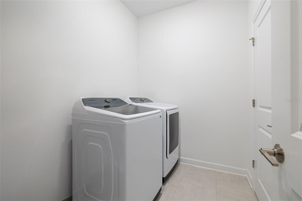 4507 Hillingdam Road Davenport, FL 33837 - Photo 24 of 83 a utility room with dryer and washer