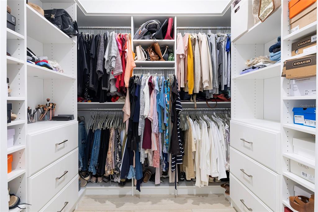 4507 Hillingdam Road Davenport, FL 33837 - Photo 41 of 83 a view of walk in closet with clothes