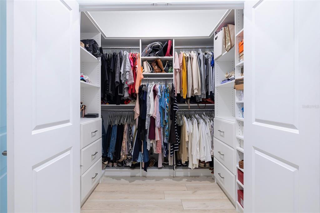 4507 Hillingdam Road Davenport, FL 33837 - Photo 43 of 83 a view of walk in closet with clothes