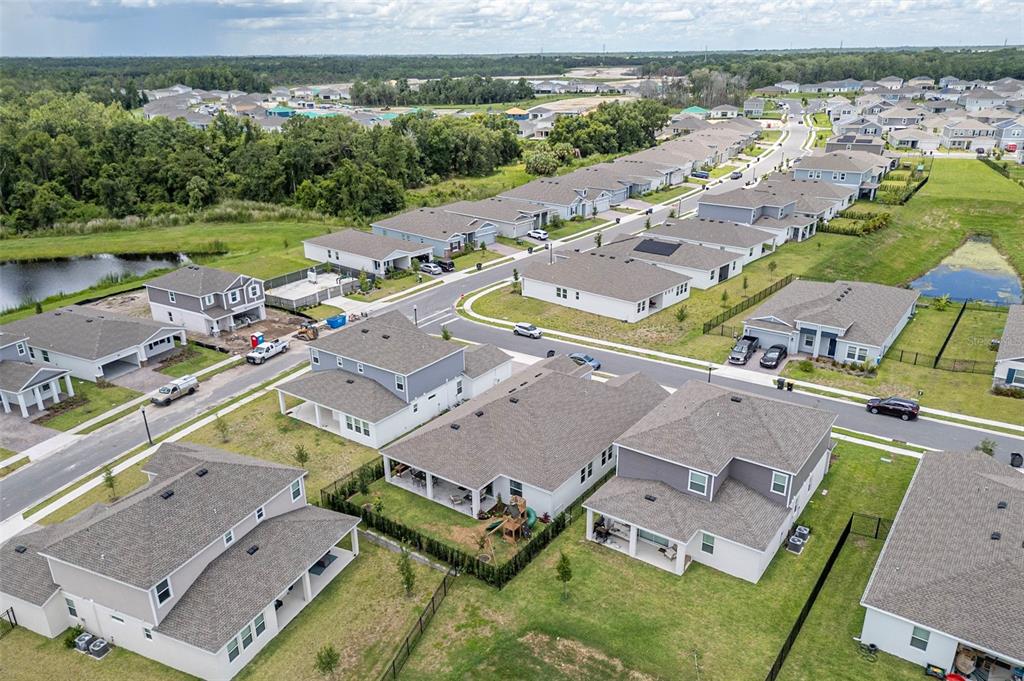 4507 Hillingdam Road Davenport, FL 33837 - Photo 55 of 83 an aerial view of a house with a lake view