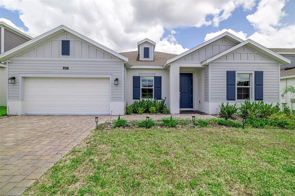 4507 Hillingdam Road Davenport, FL 33837 - Photo 81 of 83 a front view of a house with garden