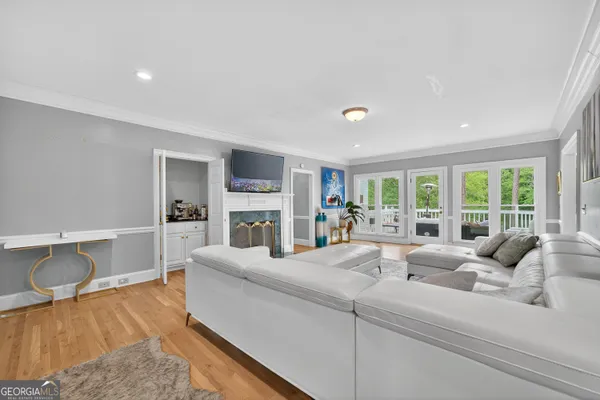 a kitchen with stainless steel appliances granite countertop a stove top oven a refrigerator and cabinets