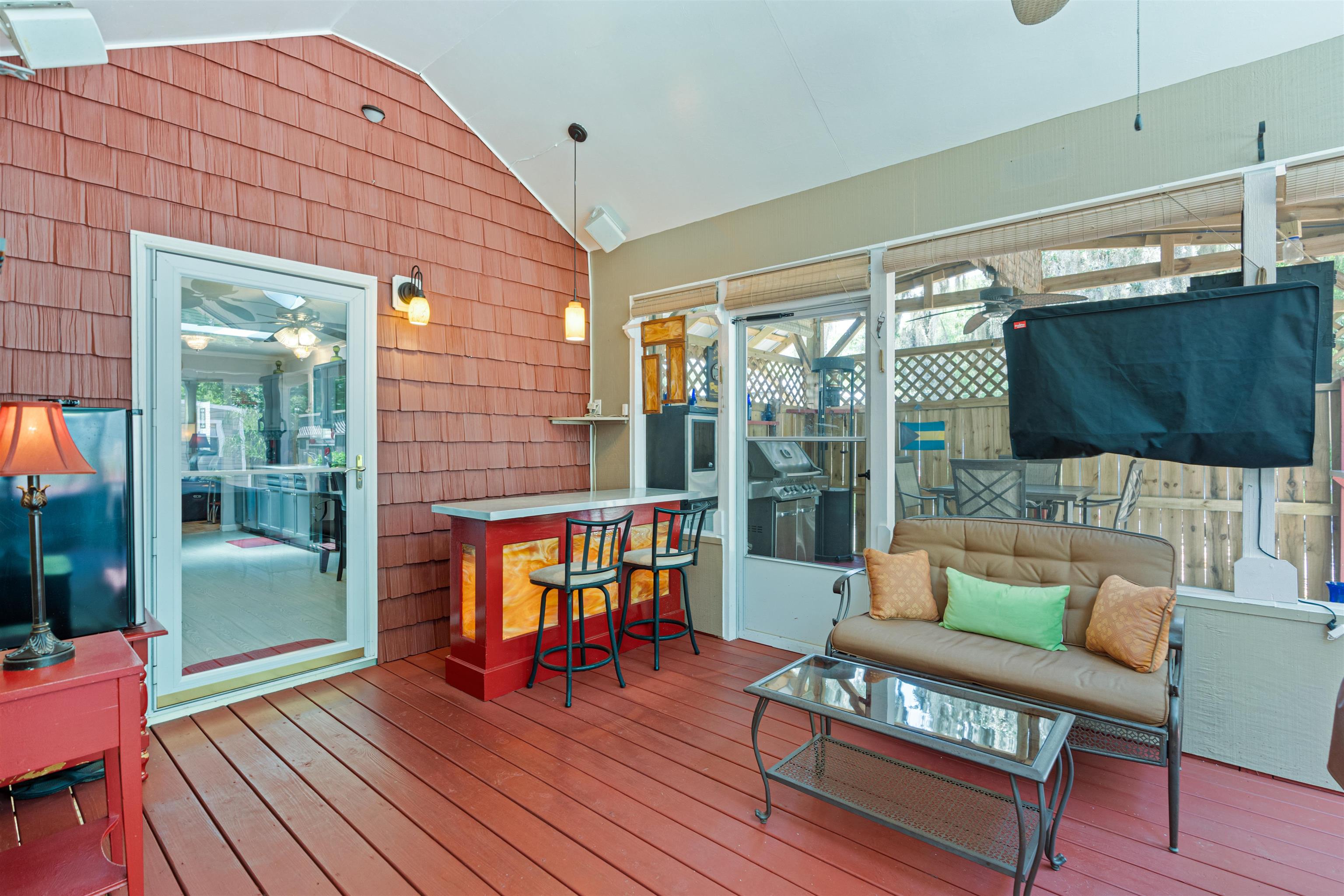 51 Spring Street St. Augustine, FL 32084 - Photo 21 of 32 a outdoor living space with furniture and wooden floor