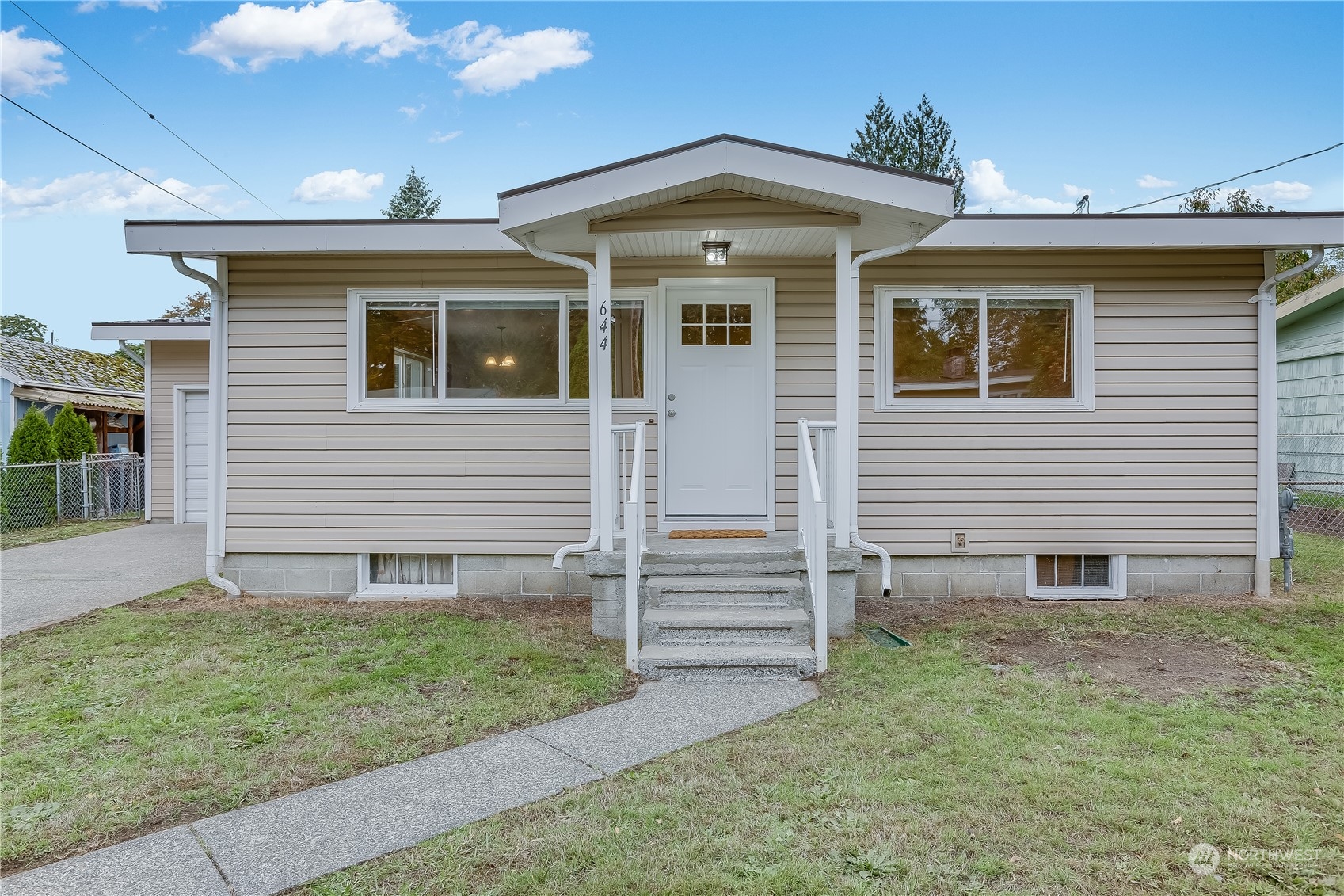 644 Ferndale Avenue Northeast Renton, WA 98056 - Photo 3 of 25 a front view of house with yard and garage