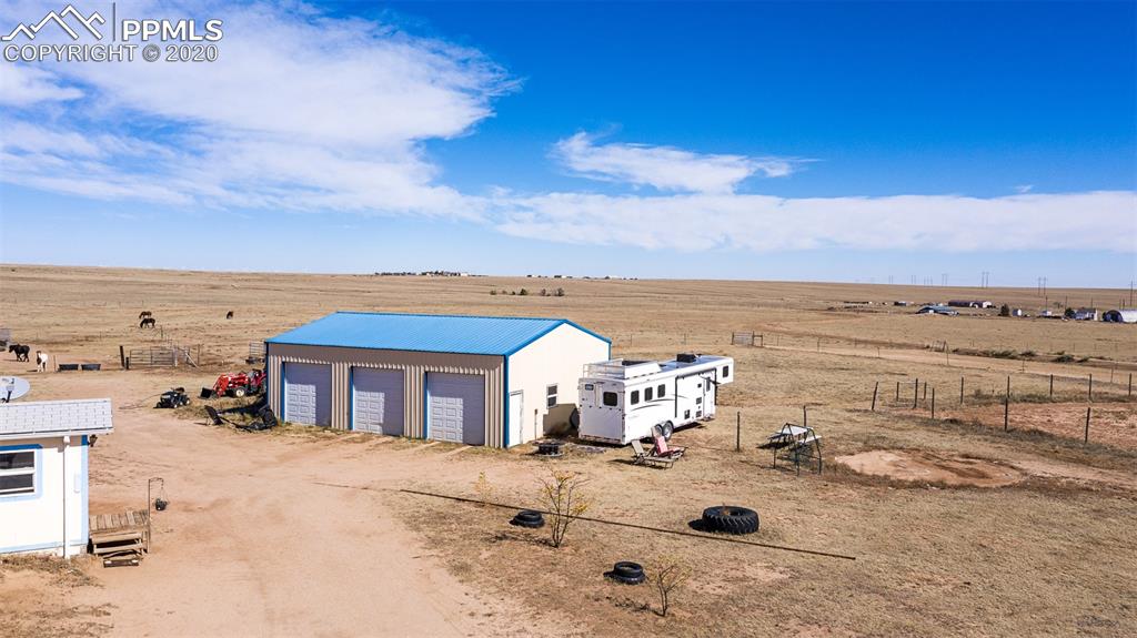 34430 East Jones Road Yoder, CO 80864 - Photo 21 of 41 30 X 40 Pole Barn-Garage - 120/240 AMP breaker box with 3 Garage Door Openers