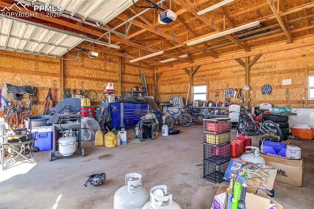34430 East Jones Road Yoder, CO 80864 - Photo 22 of 41 Interior of 3 Bay Garage/Cement Floor, OverHead Lighting, Windows