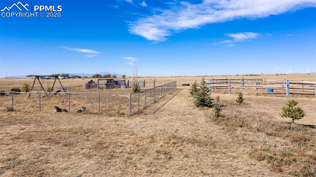 34430 East Jones Road Yoder, CO 80864 - Photo 30 of 41 Established Trees/Playground & Fenced in Dog Yard-Facing West