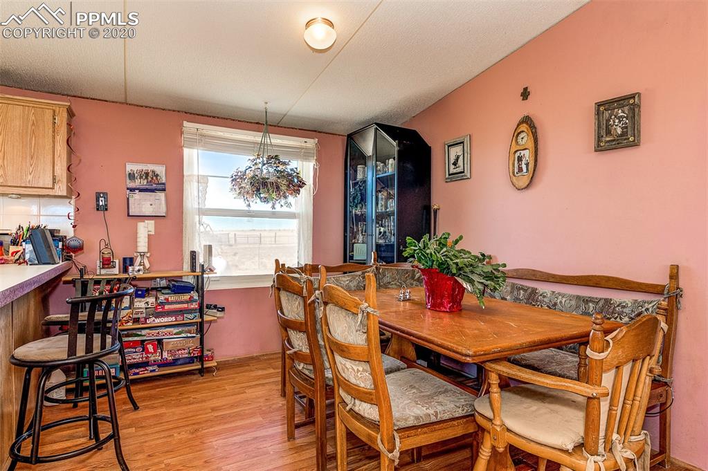 34430 East Jones Road Yoder, CO 80864 - Photo 6 of 41 Country Kitchen with Dining Area and Breakfast Bar