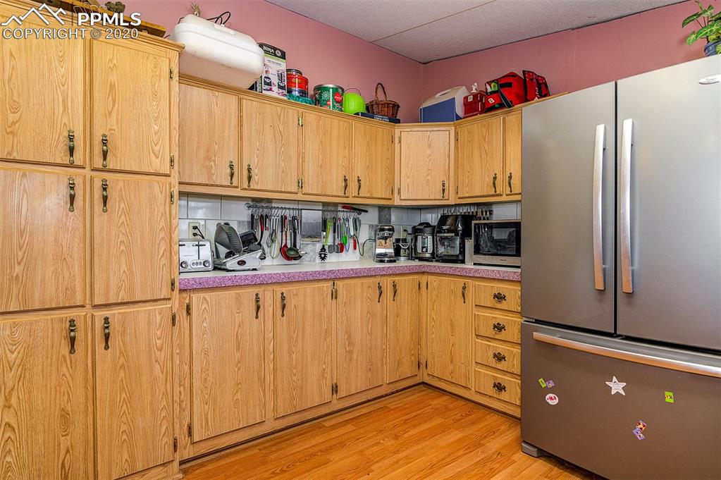 34430 East Jones Road Yoder, CO 80864 - Photo 9 of 41 LOTS AND LOTS OF CABINET SPACE! Huge French Door Refrigerator W/Pullout freezer drawer & ice maker.