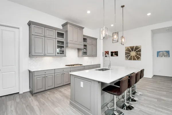 a living room with furniture windows and a table