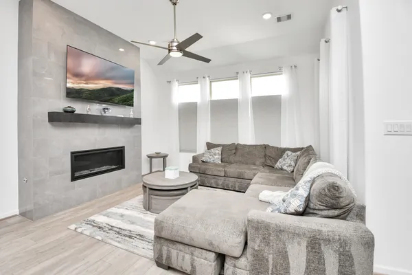 a bathroom with a sink a toilet and shower curtain