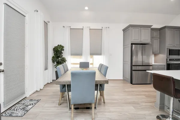 a bedroom with a bed and a tv