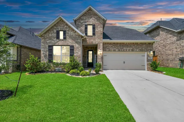 a kitchen with stainless steel appliances kitchen island granite countertop a sink and cabinets