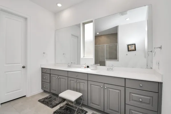 a view of swimming pool with a tub and trees in the background